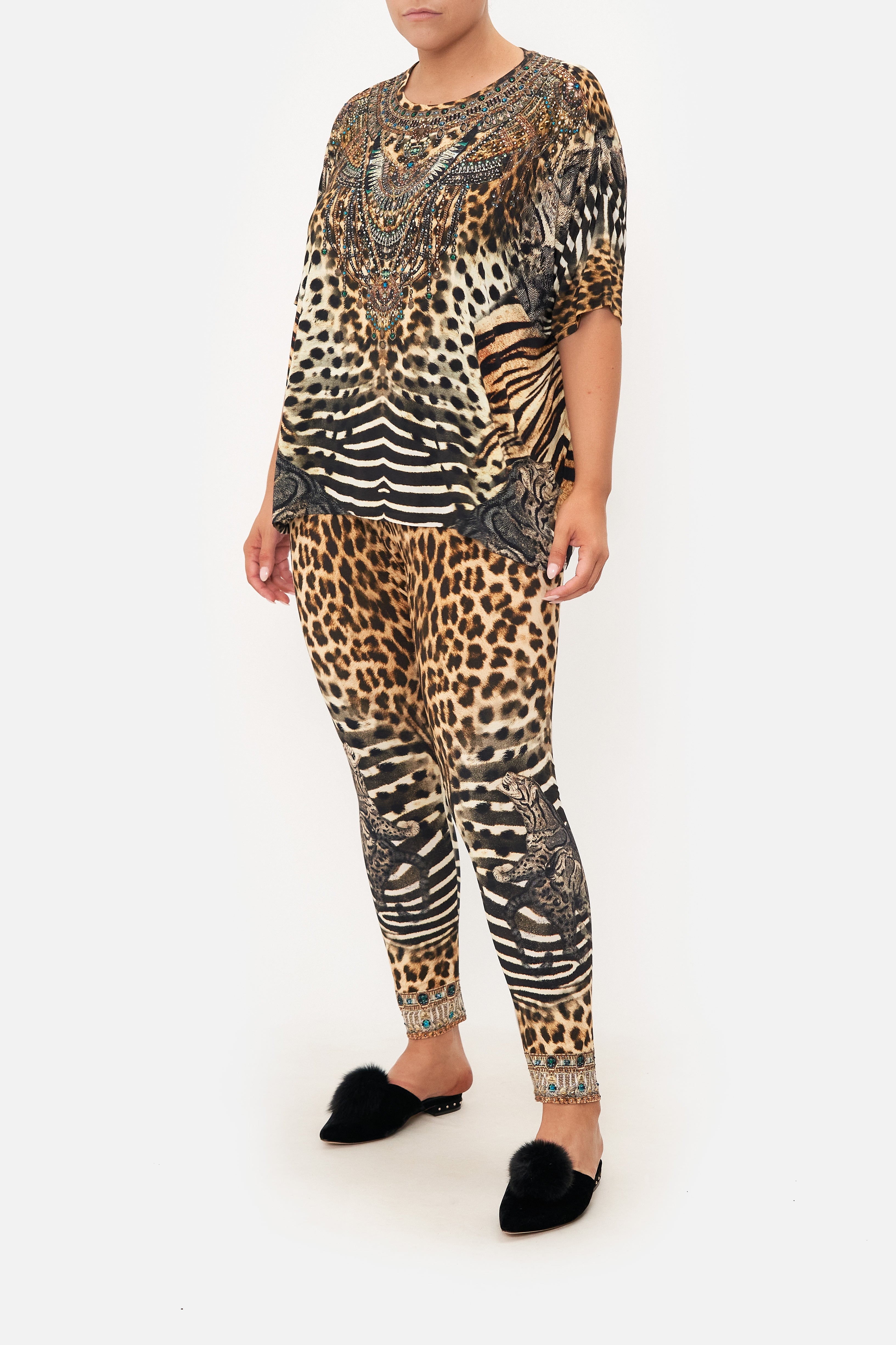 Front view of curvy model wearing CAMILLA leopard  print plus size leggings in For The Love of Leo print