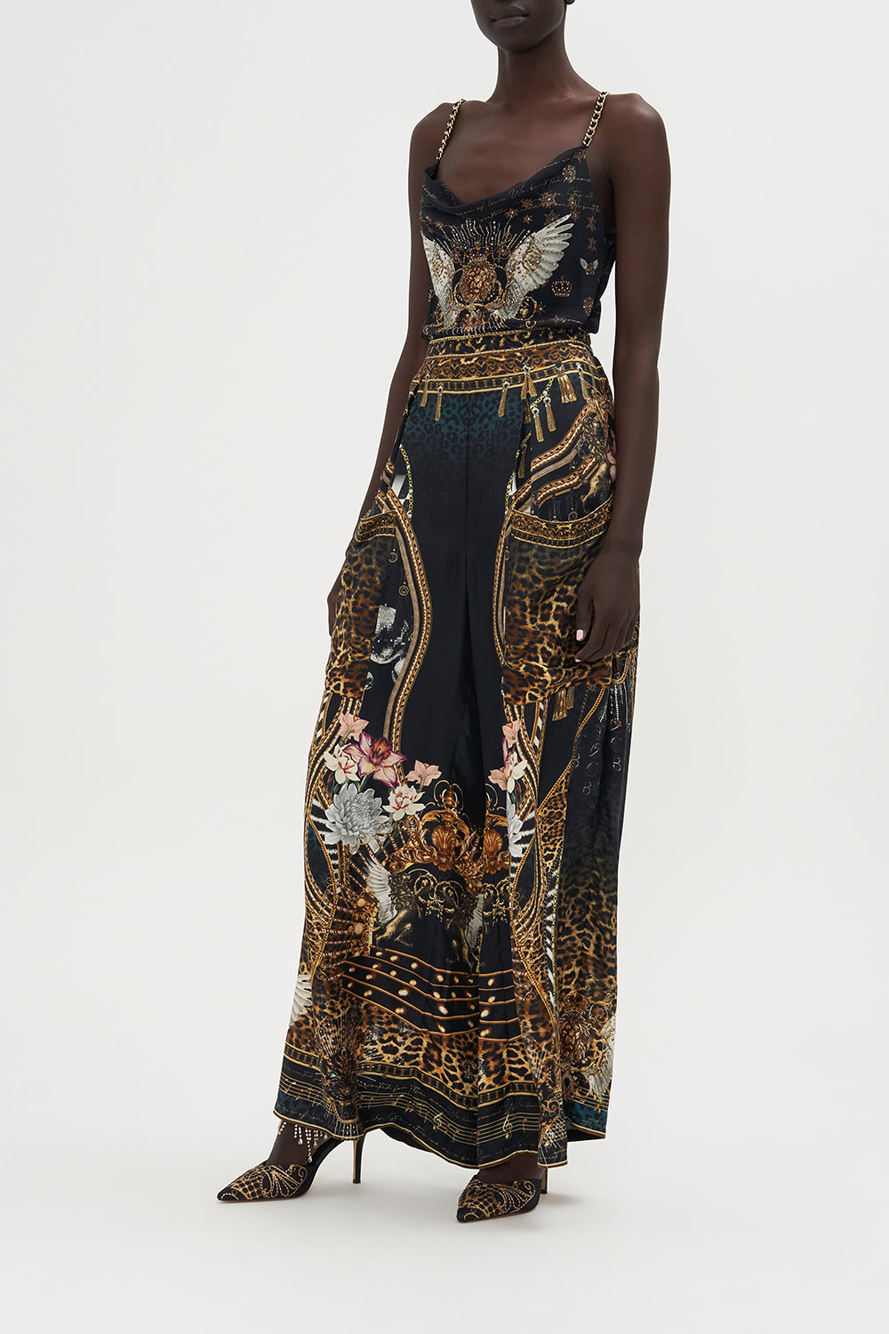 The CAMILLA DEEP V NECK ONE PIECE ROYALTY LOYALTY in our ROYALTY LOYALTY print.