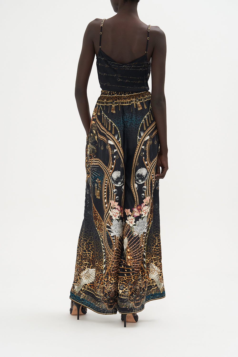 The CAMILLA TWIST FRONT DRESS WITH HARDWARE WHERES YOUR HEAD AT in our  print.